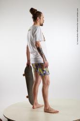 Nigel Standing Pose With Skateboard